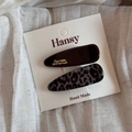 Close-up of leopard pattern and brown resin hair clips on a white display card - Small Waterdrop Style