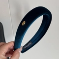 Detailed shot of dark blue velvet headband with handmade label and golden metal ornament - Dark Blue