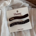 Detail of leopard print hair clip set with resin finish and gold lettered barrette - Wave Straight Style