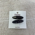 Set of two leopard print and black acetate hair clips displayed on a white card - Small Oval Style