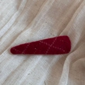 Macro detail of a burgundy wool felt hair clip with vintage stitching on soft fabric - Spotted Plaid Triangle BB-Red