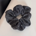 Macro shot of dark grey velvet scrunchie with sparkling silver rhinestones and soft pleats - Scrunchie
