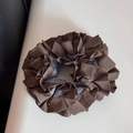 Macro view of multi-layer pleated scrunchie with dark brown fabric and blue striped details - Striped Pleated Edge - Blue