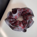 Detail view of large red and grey plaid scrunchie with ruffled grey edge and woven texture - Gray Red Plaid Fabric Scrunchie