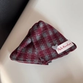 Detail of red and grey checkered fabric scrunchie with heart-shaped Luck charm and woven label - Gray Red Plaid Fabric Triangle Clip