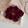 Detailed close-up of dark red velvet scrunchie with black piping on textured background - Velvet Pleated Small Circle-Red