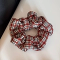 Close-up of red and white plaid fabric scrunchie with elastic pleated texture detail - Scrunchie / Red White Plaid