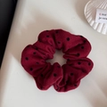 Close-up of a high-elastic deep red polka dot scrunchie on a white shell tray - Large Polka Dot Red Scrunchie (FQ88455)