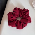 Detailed view of burgundy scrunchie with black polka dots and small bow patterns - Polka Dot Bowknot Red Scrunchie (FQ88455)