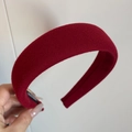 Close-up of a wide red plaid hairband featuring a padded design and textured wool fabric - Padded Headband / Solid Red