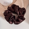 Close-up of large coffee brown satin hair scrunchie with gold glitter and shells - Coffee