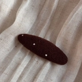 Close-up of coffee brown knitted oval hair clip with white polka dots on linen texture - Coffee Polka Dot (Oval BB Clip)