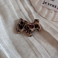 Detail view of a Scottie dog hair accessory with tortoise shell pattern and red dots - Tortoiseshell Dog (Hair Clip)