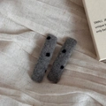 Close-up of gray plush wool hair clips with black polka dots on white linen fabric - Woolen Grey Dot Rectangle Hairpin Pair