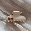 Close-up of beige acetate hair claw with brown bow and sparkling crystal detail - Off-white & Coffee Bow (Medium)