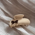 Detail of cream acetate hair claw clip with dark brown bow and sparkling rhinestone - White & Brown Bow (Medium)