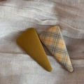 Close-up of mustard green and vintage plaid fabric triangle hair clips on beige texture - Large Triangle