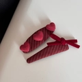 Detail of red bow hair clips with heart accents and striped fabric texture for women - Red Striped Heart Triangle Pins