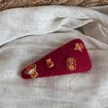 Detail of red felt hair clip with golden charms for Chinese New Year prosperity - New Year Hair Clip - Large Triangle (FJ891931)