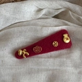 Detailed shot of dark red felt hair clip with golden Chinese New Year lucky charms - New Year Hair Clip - Thin Triangle (FJ891931)