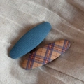 Detail showing blue twill and vintage plaid fabric-wrapped oval snap hair clips - Blue Series Pair - Large Oval