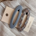 Detail of blue and plaid fabric hair clips set on display card over linen background - Blue Solid Plaid Hollow Oval Clips