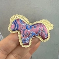 Close-up detail of the Song brocade horse brooch featuring an ornate scalloped border. - Embroidered Horse-Purple