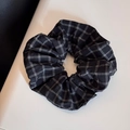 Detail of a large black and white checkered scrunchie showing fine fabric texture and pleats - Vintage Grid Black Scrunchie