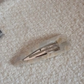Close-up of cream marble acetate hair clip with silver clip and France Handmade logo - Off-white