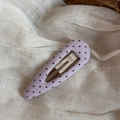 Close-up of a purple fabric BB hair clip with black polka dots on a beige background - Purple Fine Polka Dot Hollow Water Drop Style