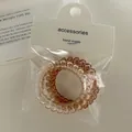 Elastici per capelli a spirale a filo telefonico color ambra e marrone con confezione - Arancione