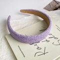 Detail of lavender satin headband with brown speckle pattern on a book - Purple Polka Dot