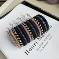 Detailed view of 15-piece elastic hair bands set displayed on an acrylic stand - Navy Black
