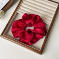 Elegant red satin oversized scrunchie hair tie with silky texture and soft luster - Red