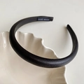 Detail of premium black faux leather padded headband with a woven Hand Made label inside - Black - Headband