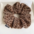 Detail of leopard print fuzzy scrunchie with Blind For Love woven label on plush fabric - High Elastic (FQ-0729) / Coffee Plush Leopard
