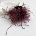 Detail view of the deep wine red feather and mesh bow claw clip with elegant shell decor - Red Feather Claw Clip