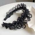 Eleganter schwarzer Spitzenstirnband mit glitzernden Pailletten und Perlenblumen-Design - Perlenblume