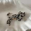 Close-up of a cat-shaped acetate hair clip with black and white marble pattern on a tray - Cat Shape (Black And White) / Black and White