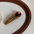 Detail of a handmade vintage knit hair clip with yellow stripes and a gold heart charm - Yellow Coffee - Gold Heart BB Clip