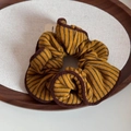 Detailed texture of ginger striped knitted scrunchie on a wooden tray accessory - Yellow Coffee - Large Hair Tie