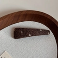 Close-up of vintage dark brown polka dot fabric hair clip on a wooden display tray - Coffee Polka Dot Thin Triangle