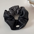 Detail of faux leather and leopard print fabric hair scrunchie with oval metal tag - Leather Patchwork Scrunchie / Gray Leopard