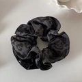 Detailed close-up of leopard print and black leather patchwork hair scrunchie texture - Waist Ring Scrunchie / Gray Leopard