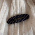 Close-up of vintage blue striped tweed fabric texture on a large elegant hair claw clip - Navy Striped - Oval BB Clip