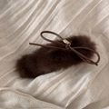 Close-up of brown plush bow hair clip with luxury gold metal pendant detail - Dark Brown