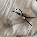Detail of plush khaki hair clip with brown woven bow and golden metal charm - Off White