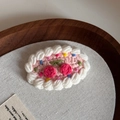 Detail of hand-knitted pink cake hair clip with white cream lace and cherry topping - Handmade Crochet BB-Pink Cherry