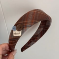 Detail of wide plaid headband featuring vintage buttons and woven label ornament - Brown Gray Fabric Blue Coffee Button Headband