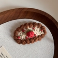 Detailed macro view of a handmade crochet strawberry hair clip on a wooden tray - Handmade Crochet BB-Beige Strawberry